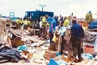 In a recent enforcement operation, the Lagos State Environmental Sanitation Corps apprehended two traders as they demolished shops along Akiogun Road