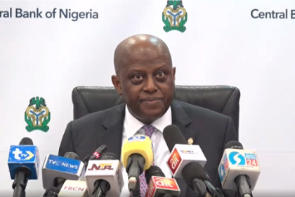 CBN Governor Olayemi Cardoso speaking at MPD 20th anniversary, graph showing Nigeria’s external reserves increase