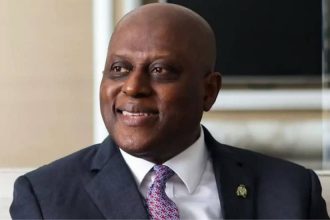 “CBN Governor Olayemi Cardoso speaking at a strategic economic session in Abuja