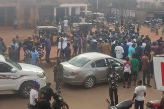 Protesters block Ijoka road in Akure, Ondo State, demanding the government complete the abandoned project.