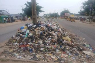 Residents disposing of household waste in Lagos