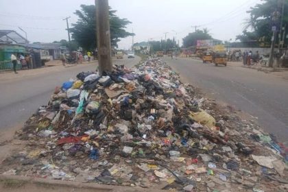 Residents disposing of household waste in Lagos