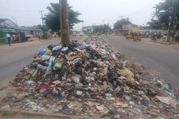 Residents disposing of household waste in Lagos