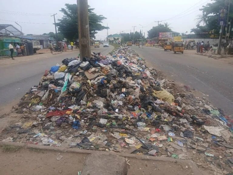 Residents disposing of household waste in Lagos
