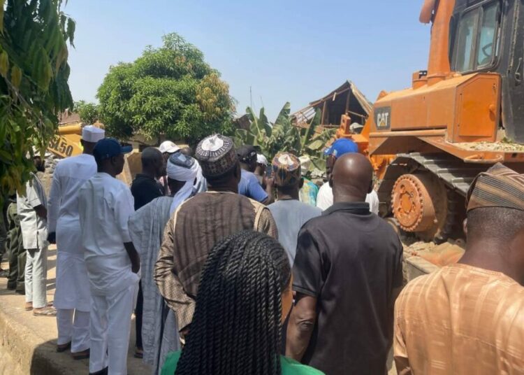 “PCC officials inspecting halted demolition at Winning Clause Estate in Gwarinpa, Abuja”