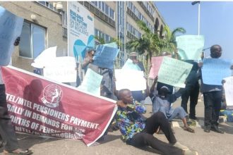 Elderly pensioners sitting on the floor demanding payment of arrears
