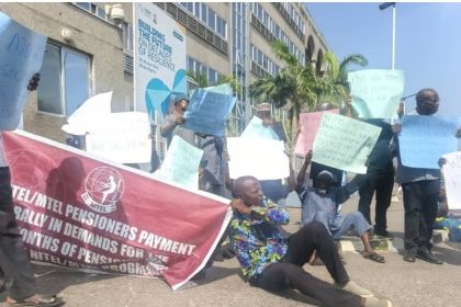 Elderly pensioners sitting on the floor demanding payment of arrears